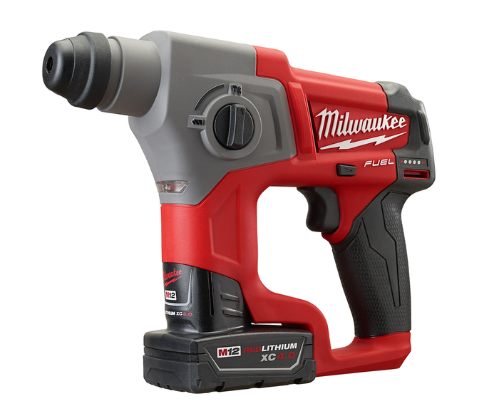 Cordless Milwaukee rotary hammer drilling into concrete wall